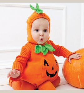 photo of baby in halloween pumpkin costume